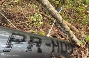 Corpos de ocupantes de helicóptero são encontrados junto aos destroços (Foto: Reprodução)